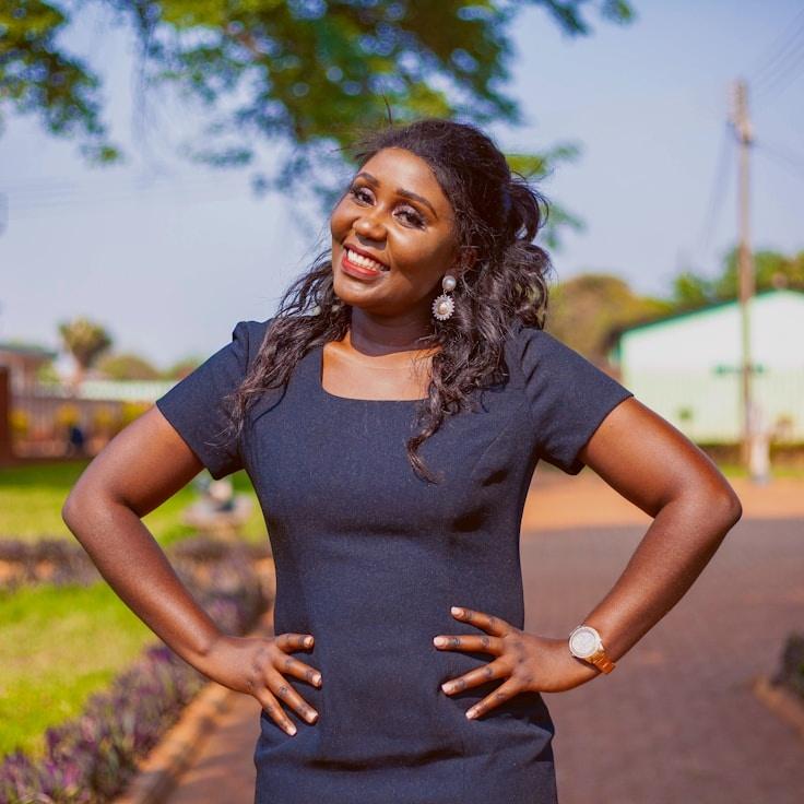 Avery Chen, Lead Design Curator at RootBranchPark, reviewing corporate floral arrangements